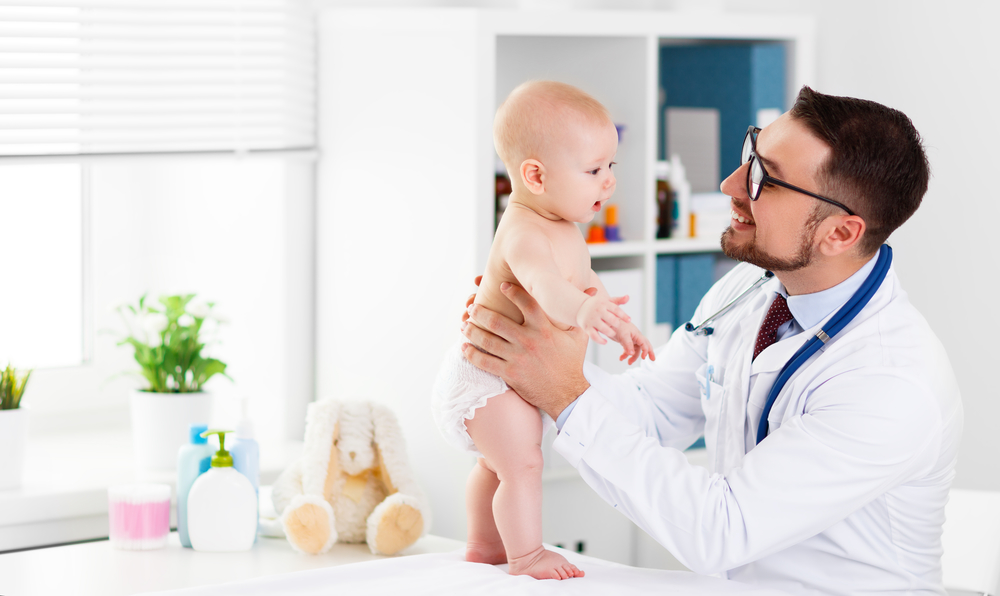 Doctor pediatrician with baby child