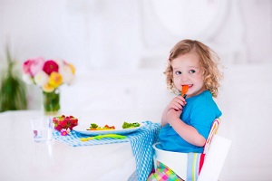 bigstock-Little-Girl-Having-Lunch-93857594